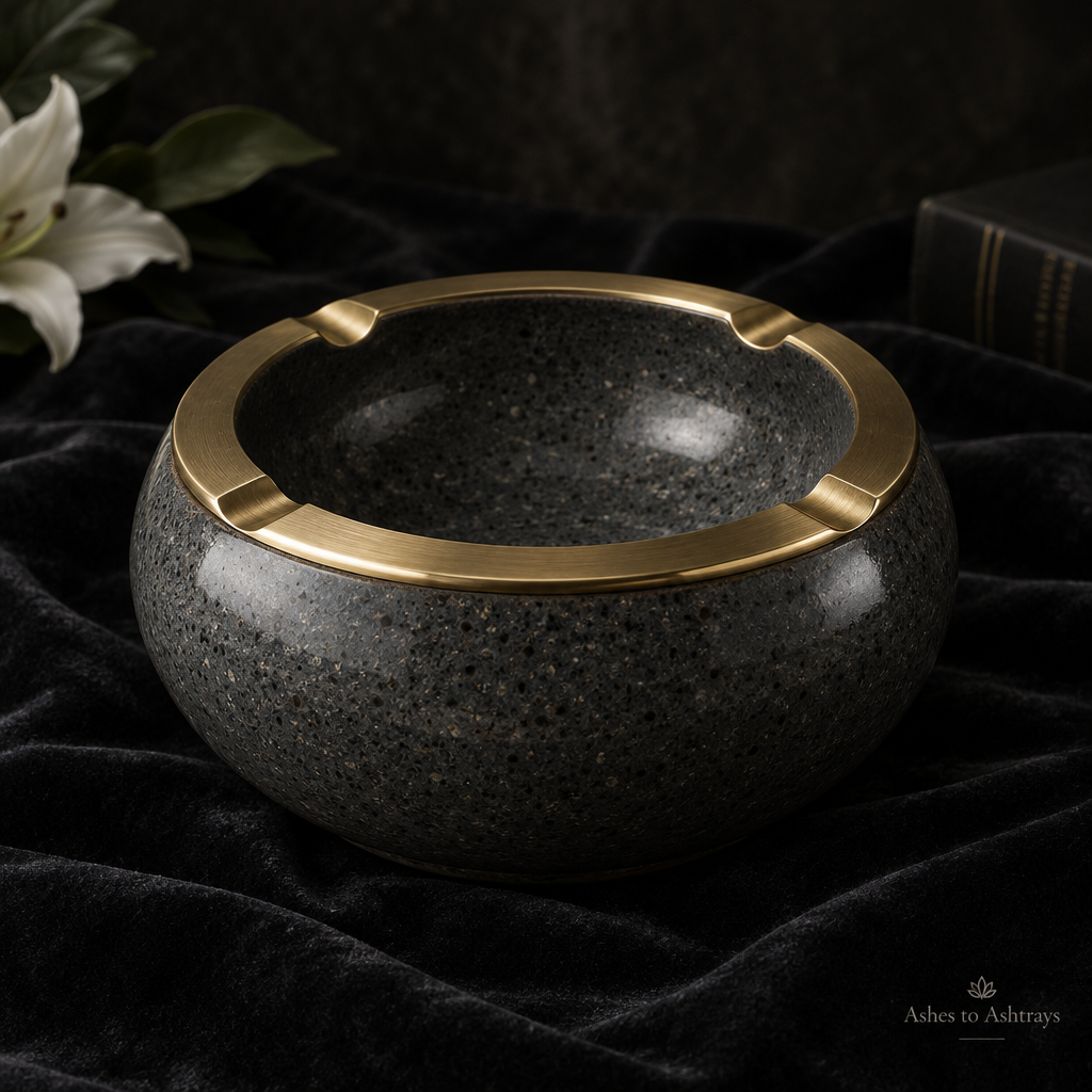 The Urnest, a round charcoal ceramic ashtray with brass rim